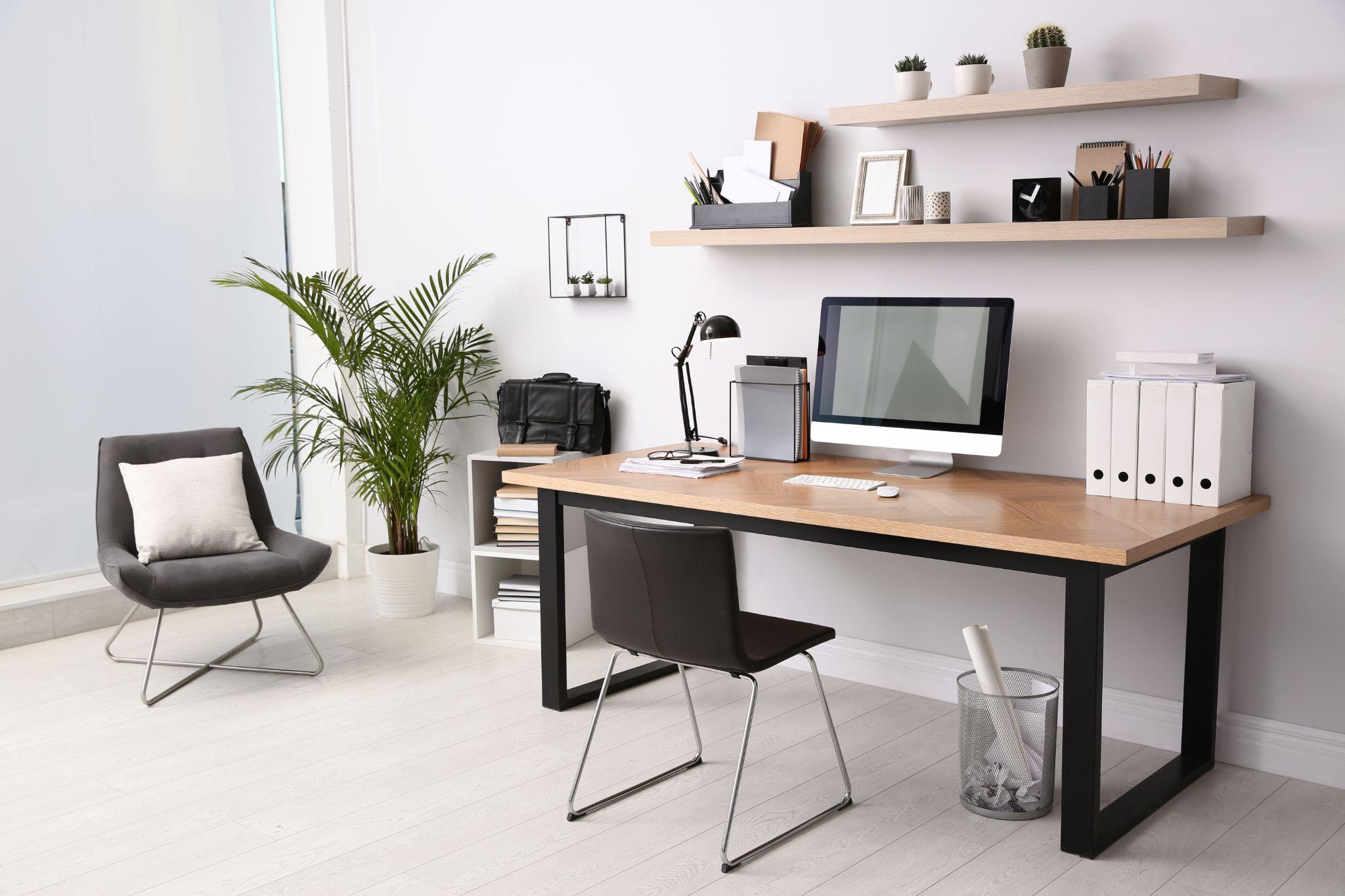 Modern computer on table in office interior