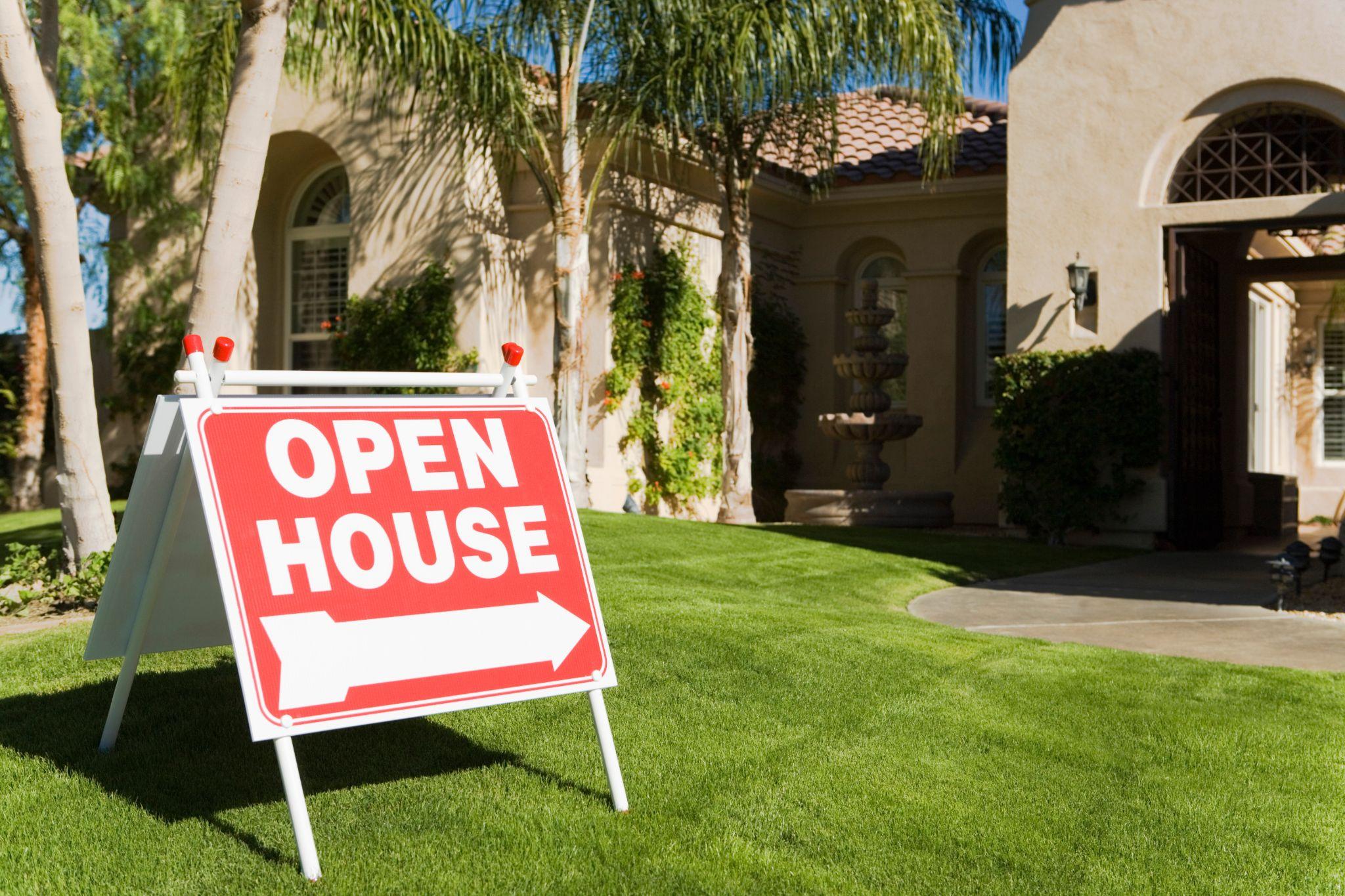 Open house sign in front of a house